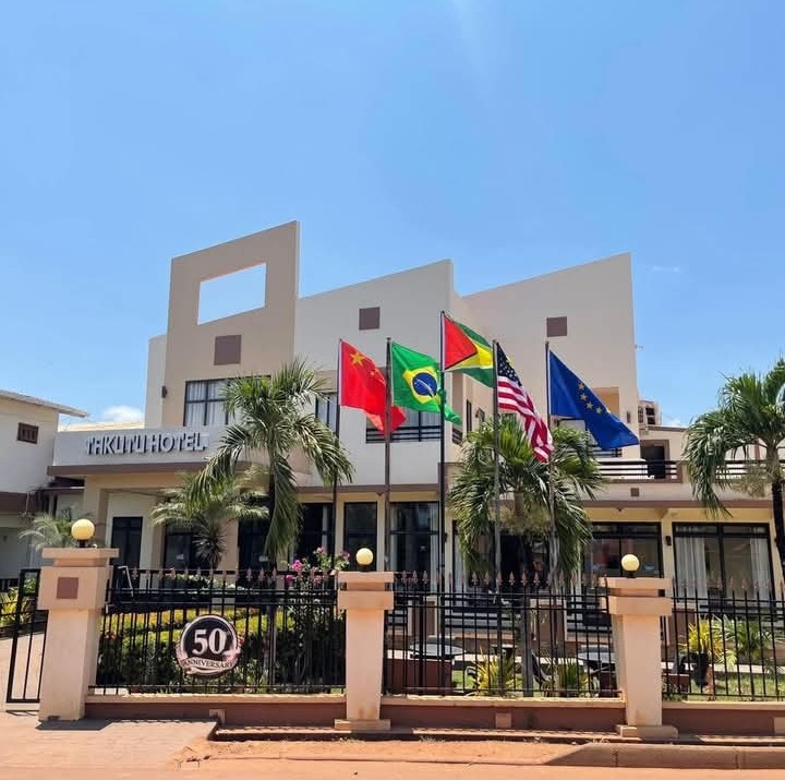 Takutu Hotel facade with international flags in Lethem, Guyana